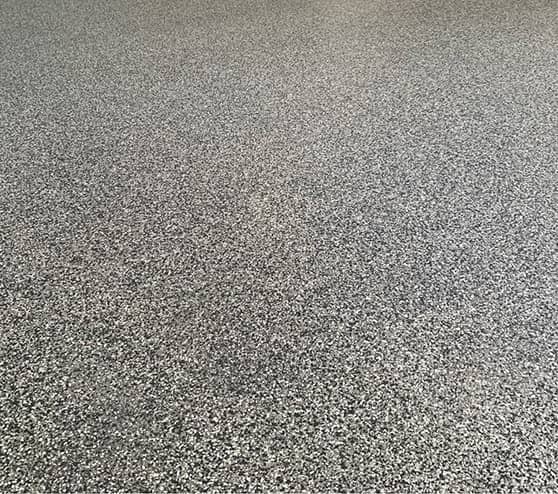 close-up of epoxy flake flooring in garage
