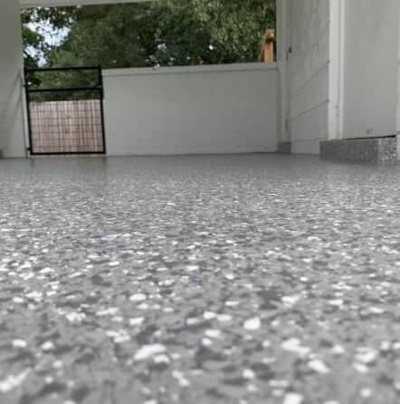epoxy flake flooring installed for homeowner laundry room and car port