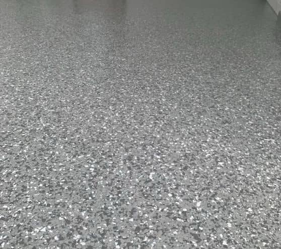 close-up of epoxy flake flooring installed for car port