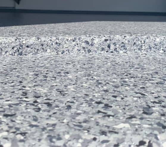 close-up of night fall epoxy flake flooring for joshua garage