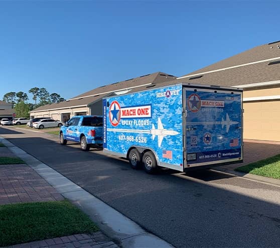 mach one truck and trailer in street in front of house