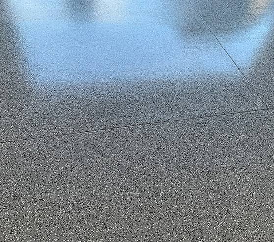close-up of flake epoxy flooring in garage