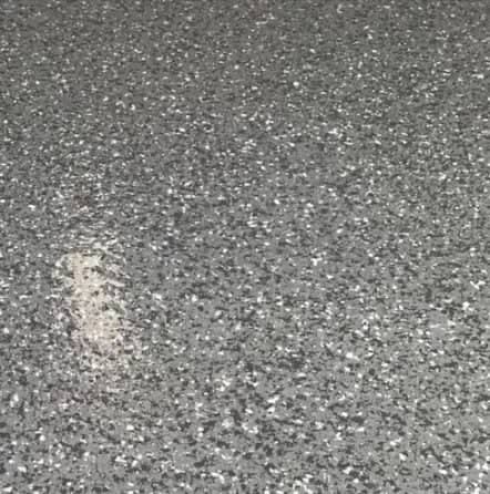 close-up of epoxy flake flooring for jim garage
