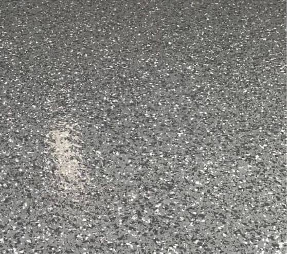 close-up of epoxy flake flooring for jim garage