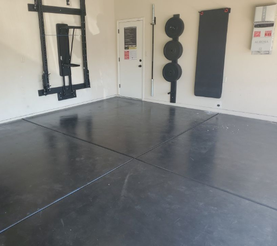 garage gym prior to receiving an epoxy floor application