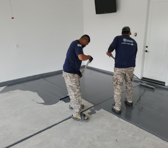 two employees installing epoxy