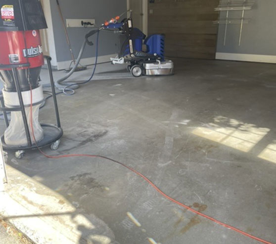 before graniflex flooring application in two-car garage