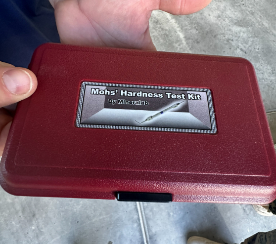 person holding a hardness test kit