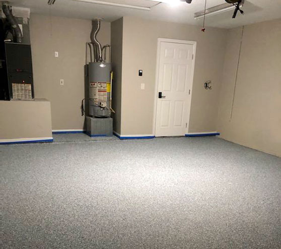 new epoxy floor finish on fish hawk garage interior