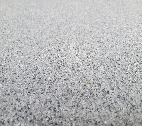 a close up of gray epoxy flooring