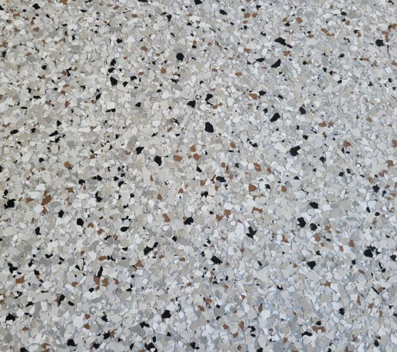 close view of dakota grey epoxy flake flooring