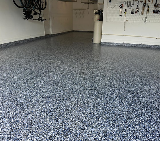blue epoxy flake flooring in garage at residential home
