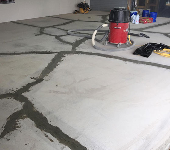 close-up of garage floor getting repaired