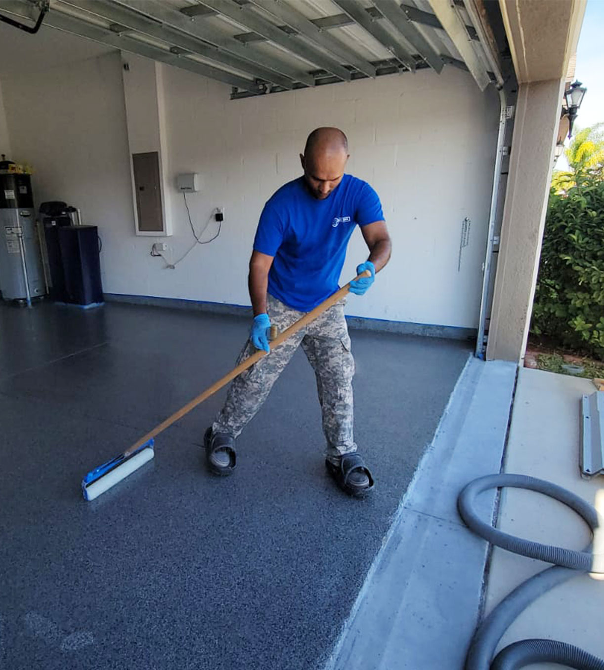 mach one employee installing epoxy floor